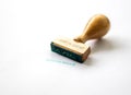 A wooden stamp marks the geman word Royalty Free Stock Photo