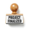 Wooden stamp with project finalized text on white background Royalty Free Stock Photo