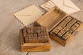 Wooden stamps alphabet and vintage envelopes