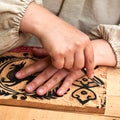 Wooden stamps for medieval ink printing on fabric and vintage clothing. Reconstruction of the events of the Middle Ages in Europe Royalty Free Stock Photo
