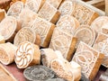 Wooden stamps printing blocks hand carved by artisans on the street market in Jaisalmer, India.