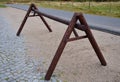 Wooden stand for hanging bicycles behind the saddle. mountain bikes cannot be placed well in classic stands due to wide handlebars