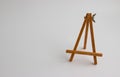Wooden stand for pictures and photos on a light background Royalty Free Stock Photo