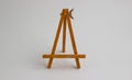 Wooden stand for pictures and photos on a light background Royalty Free Stock Photo