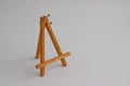 Wooden stand for pictures and photos on a light background Royalty Free Stock Photo