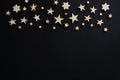Wooden stars on a black background. Chalk board. Postcard. Men`s Day. Night. Astronomy