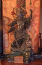 Wooden statue depicting one of the Four Heavenly Kings buddhist deity of Bishamonten depicted holding a lance in the Tendai