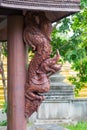 Wooden statue of King of Naga & x28;Serpent King& x29; on wooden poll Royalty Free Stock Photo