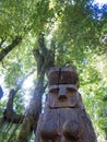 Wooden statue, in the middle of the Huilo Huilo Biological Reserve, regressing animals and Mapuche mystical characters from Royalty Free Stock Photo