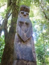 Wooden statue, in the middle of the Huilo Huilo Biological Reserve, regressing animals and Mapuche mystical characters from Royalty Free Stock Photo