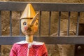 Wooden statue of Pinocchio with donkey ears and long nose. Pinocchio is the protagonist of a famous Italian fairy tale Royalty Free Stock Photo