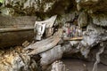 Wooden statues of Tau Tau and coffins in TampangAllo burial cave at Tana Toraja. Indonesia