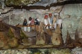 Wooden statues of Tau Tau and coffins in TampangAllo burial cave at Tana Toraja. Indonesia