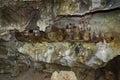 Wooden statues of Tau Tau and coffins in TampangAllo burial cave at Tana Toraja. Indonesia