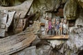 Wooden statues of Tau Tau and coffins in TampangAllo burial cave at Tana Toraja. Indonesia