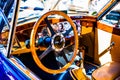 Wooden steering wheel and a dashboard Royalty Free Stock Photo