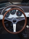 Wooden steering wheel and leather dashboard of a classic vintage Royalty Free Stock Photo