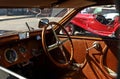 Wooden steering wheel and leather interior  of a Thirties   italian Bugatti car Royalty Free Stock Photo