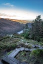 Wooden steps of a boardwalk on the top of a mountain with a view on Glendalough lakes, Wicklow Mountains Royalty Free Stock Photo
