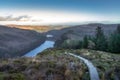 Wooden steps of a boardwalk on the top of a mountain with a view on Glendalough lakes, Wicklow Mountains Royalty Free Stock Photo