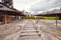 Wooden steps footpath and straw parasol sunshades on the sands of a beach Royalty Free Stock Photo