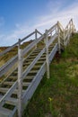 Wooden steps heading down over the beach and sand dunes at Lowestoft Suffolk Royalty Free Stock Photo