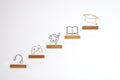 Wooden steps about school age activities on white background. Conceptual image of success, victory and development Royalty Free Stock Photo