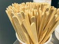 Wooden sticks for stirring the drink. many sticks in a plastic glass. coffee machine at a gas station. preparation of hot drinks. Royalty Free Stock Photo