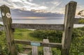 Wooden stile allowing access the a coastal walking path in Wales