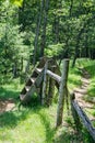 Wooden Stile Crossing a Fence in a Mountain Meadow Royalty Free Stock Photo