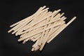 Wooden stirrers for coffee, tea and drinks, on a black background Royalty Free Stock Photo