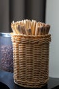 Wooden stirring sticks are in a wicker basket Royalty Free Stock Photo