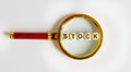 Wooden STOCK with the text: funds on a magnifying glass