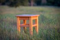 Wooden stool on grass Royalty Free Stock Photo