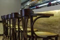 Wooden stools for customers in a bar Royalty Free Stock Photo