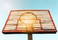 Wooden street basketball board with sunny sky. Vintage tone filter effect color style