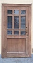 Wooden street door with glass inserts in the yellow wall, the cafe is closed, quarantine Royalty Free Stock Photo