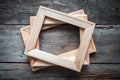 Wooden stretcher bars on dark wooden background.