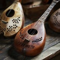 Wooden string instruments on rustic table Royalty Free Stock Photo