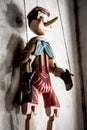 Wooden String Puppet Boy hanging on a wall