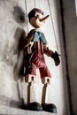 Wooden String Puppet Boy hanging on a wall