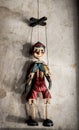 Wooden String Puppet Boy hanging on a wall