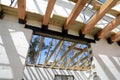 The wooden structure of the building. Installation of wooden beams at construction the roof truss system of the house.