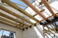 The wooden structure of the building. Wooden roof frame building. TFB system comprises thermo blocks filled with concrete.