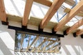 The wooden structure of the building. Wooden roof frame building. TFB system comprises thermo blocks filled with concrete.