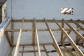 The wooden structure of the building. Wooden roof frame building. TFB system comprises thermo blocks filled with concrete.