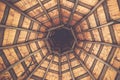 Wooden structure. Interior roof beams in wooden gazebo. Old wooden ceiling. Architectural design of a gazebo