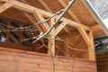 Wooden structure in the winter forest. Icicles on the roof. They ate in the snow. Royalty Free Stock Photo