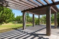 Wooden structures in garden of Troia covered with green trees, Grandola municipality, Portugal