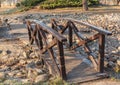 Wooden stylized eastern bridge in the Japanese garden Royalty Free Stock Photo